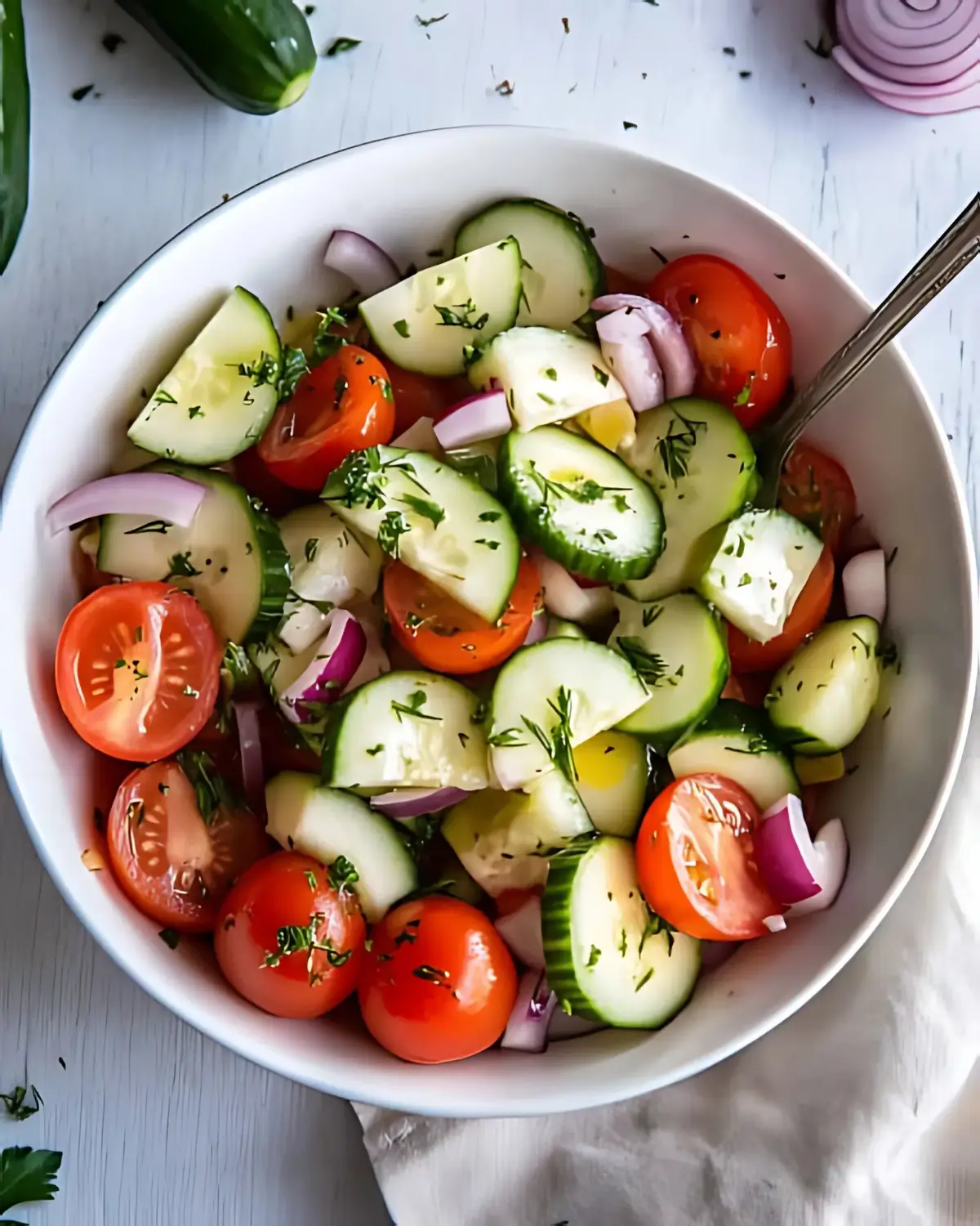 Close-Up Cucumber Tomato Salad with Fresh Herbs and Red Onion