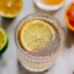 Close-up of gelled lemon chia water with chia seeds and citrus in glass