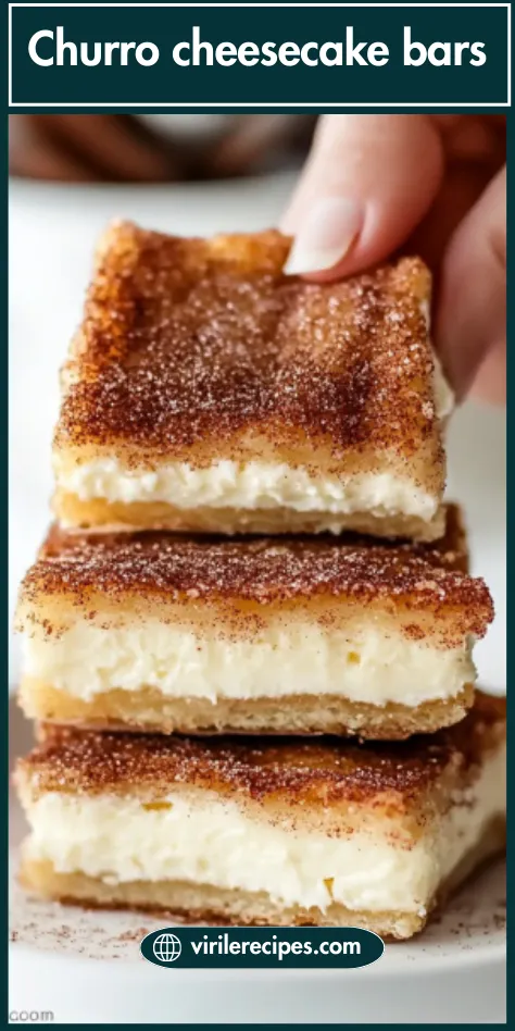Hand picking up a cinnamon-topped Churro Cheesecake Bar from a stacked plate, showing creamy layers and flaky crust.