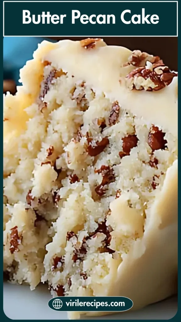 Close-up of a fluffy butter pecan cake slice with creamy frosting and chopped pecans, highlighting the cake’s moist texture.
