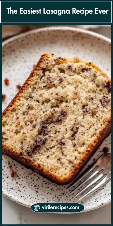 Close-up of a thick slice made Using Ripe Bananas, revealing a soft, tender crumb with chocolate flecks throughout.
