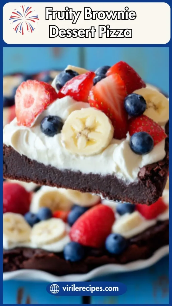 Close-up of a brownie pizza slice topped with whipped cream, strawberries, blueberries, and banana slices on a fudgy brownie base.