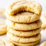 soft sugar cookies with a bite taken out of the top cookie