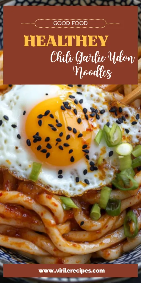 Healthy chili garlic udon noodles in a blue bowl topped with a runny egg, green onions, and black sesame seeds, labeled as “Good Food”