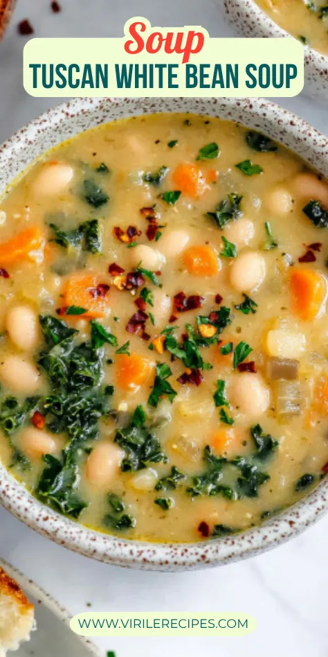 Close-up of creamy Tuscan white bean soup in a ceramic bowl, with carrots, kale, cannellini beans, and herb garnish