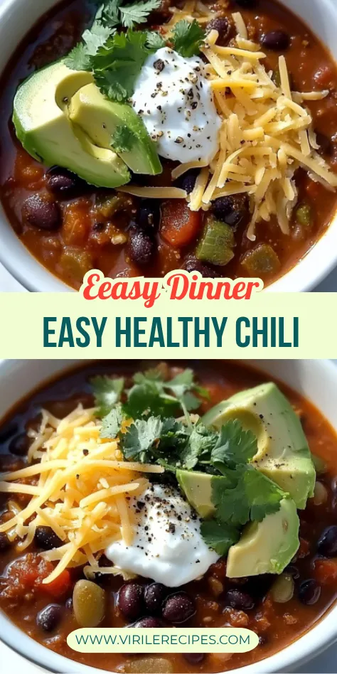 Bowl of chili with avocado slices, shredded cheese, fresh cilantro, yogurt, and a lime wedge