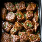 Air fryer garlic butter steak bites with crispy edges and fresh parsley