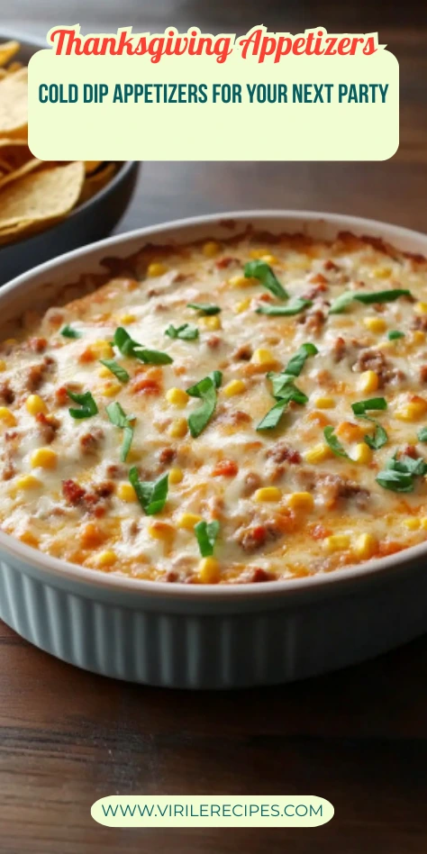 Thanksgiving cowboy crack dip in a white baking dish topped with corn, sausage, cheese, and green onions, served with tortilla chips