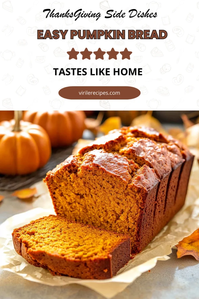 Golden pumpkin bread loaf sliced open on parchment paper with mini pumpkins in the background.