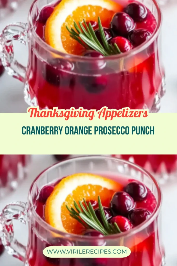 Cranberry orange punch with prosecco in glass cups, styled for Thanksgiving with fresh rosemary and citrus slices