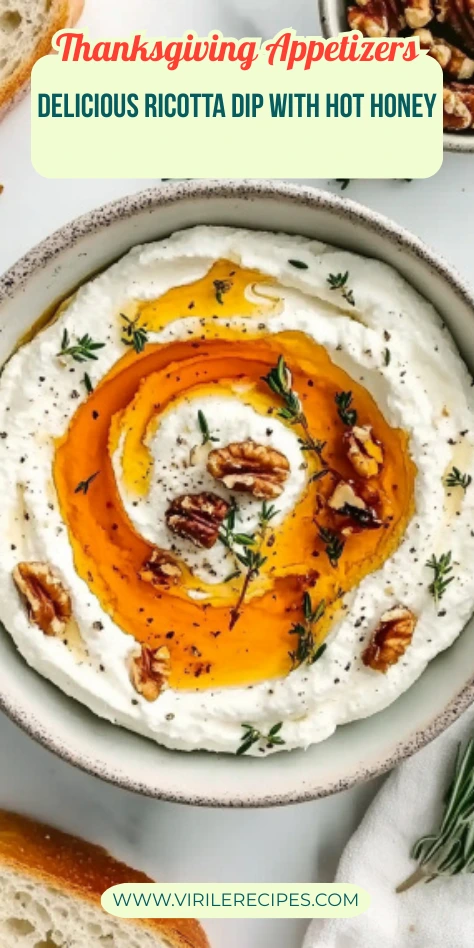 Spicy ricotta dip topped with hot honey, walnuts, and rosemary in a ceramic bowl – perfect Thanksgiving appetizer