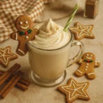 Holiday-themed creamy drink with whipped cream, gingerbread cookies, cinnamon sticks, and festive decor.