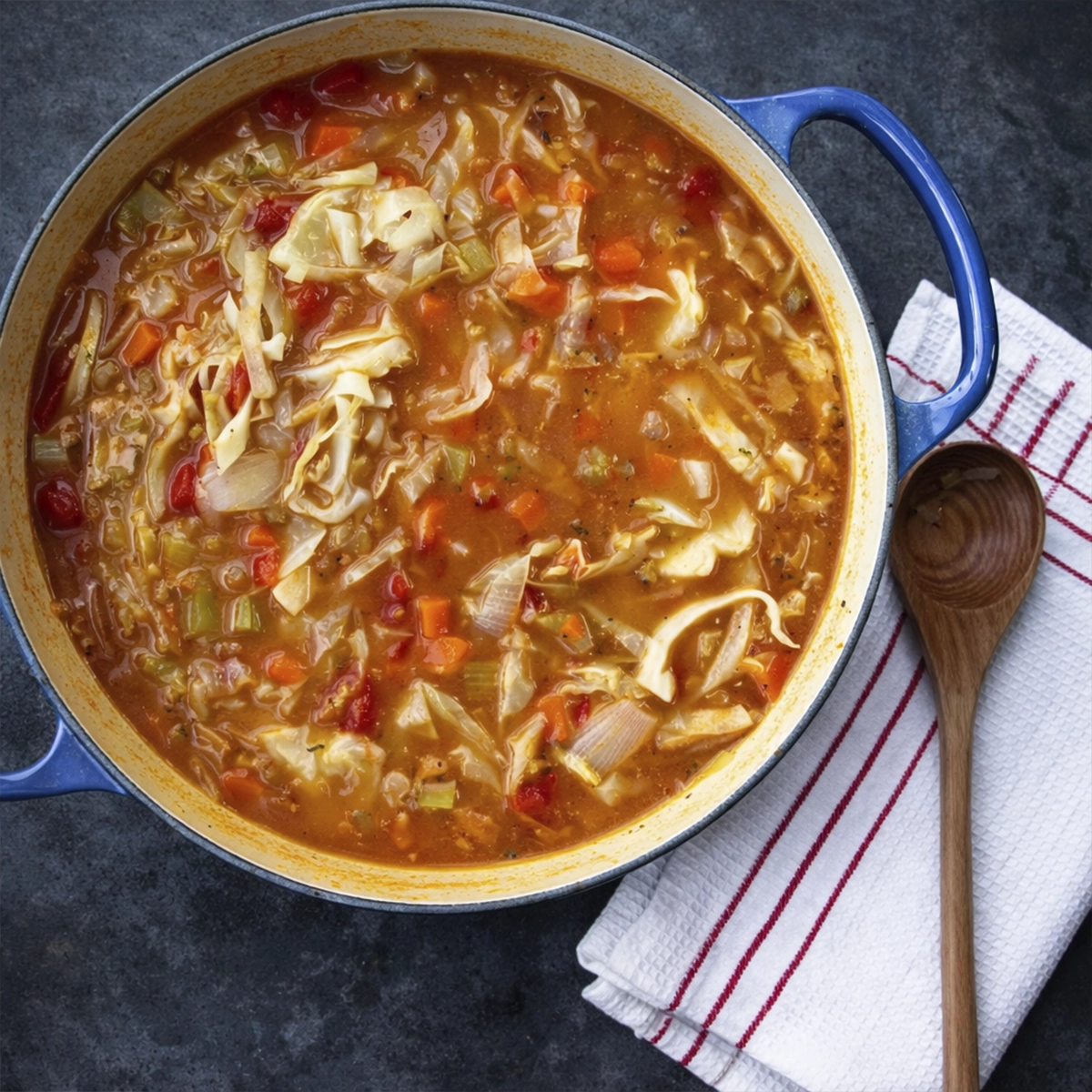 detox cabbage soup with fresh vegetables on white background clean eating low calorie meal