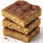 Stacked cinnamon sugar dessert bars with a soft buttery texture and crackly snickerdoodle topping